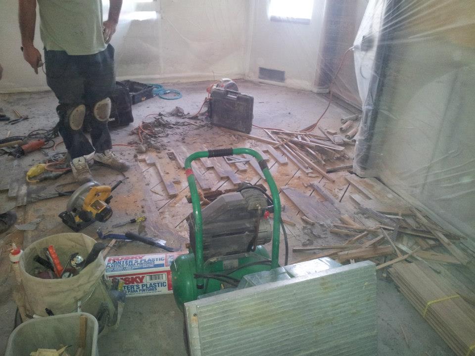 Hardwoods being re-laced to accommodate new kitchen layout